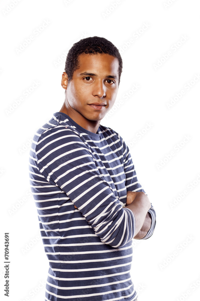 Serious dark-skinned young man with arms crossed Serious dark-skinned young man with arms crossed