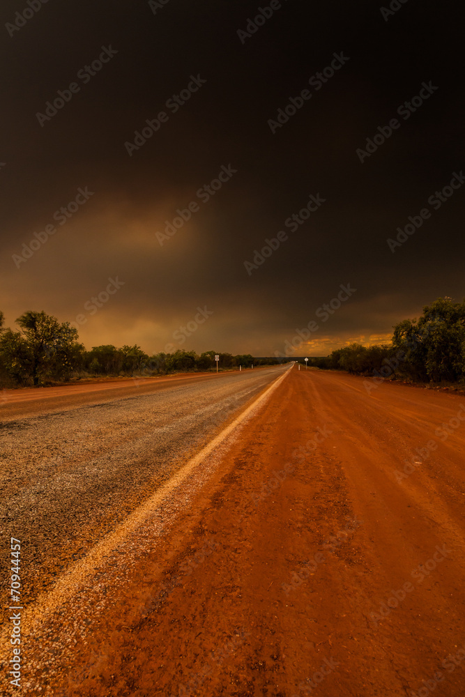 Bush fire in the Outback Australia from a highway point of view