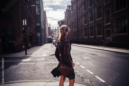 Young woman walking in street