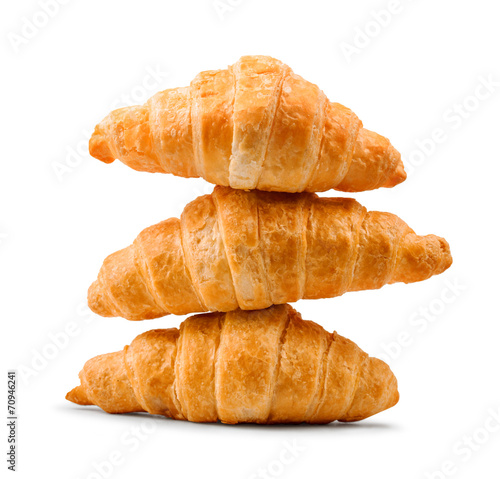 Photographie pile of fresh and delicious croissants on a white background