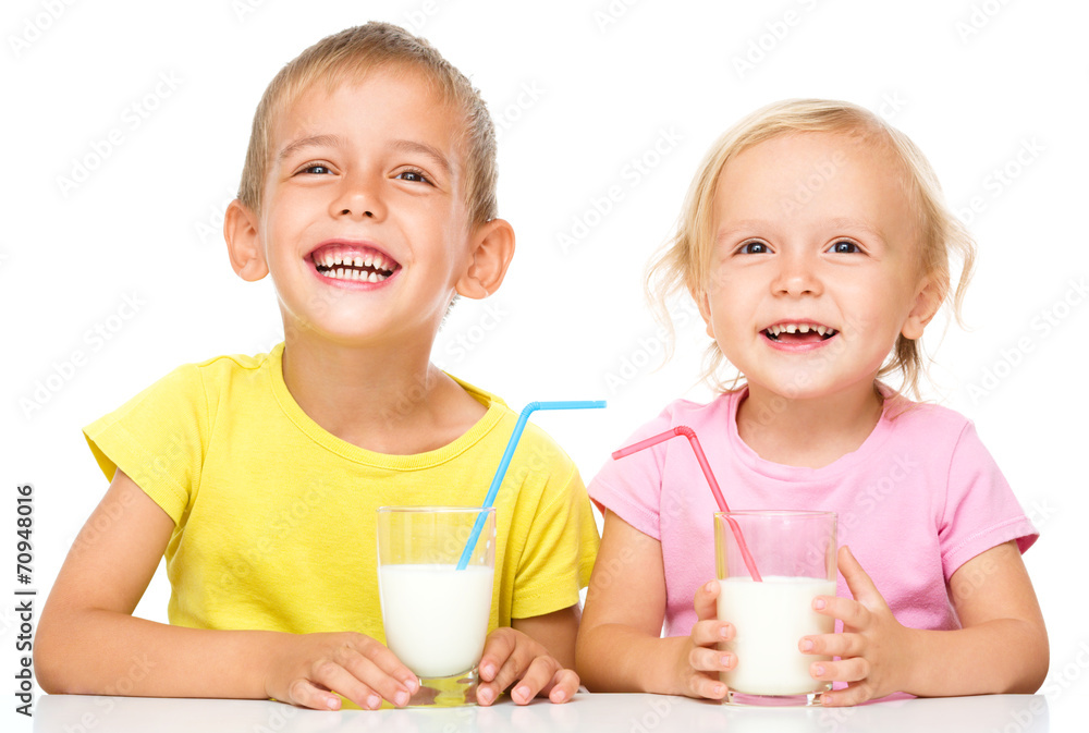 Cute little girl and boy are drinking milk Cute little girl and boy are drinking milk