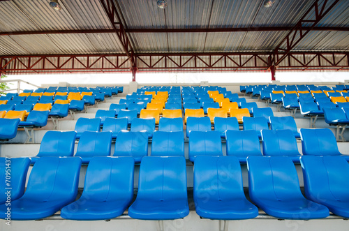 Empty plastic chairs  on grandstand stadium