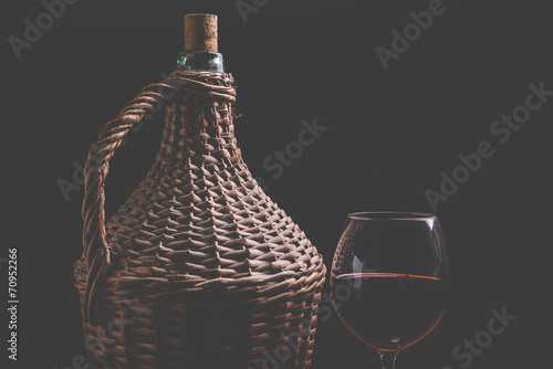 Obraz na plátně wine carboy and wine glass