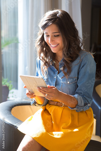 Couple using tablet with sunbeams and lens flare