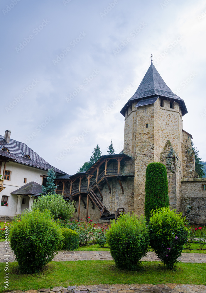 Old tower at Putna Monastery in Moldavia region of Romania
