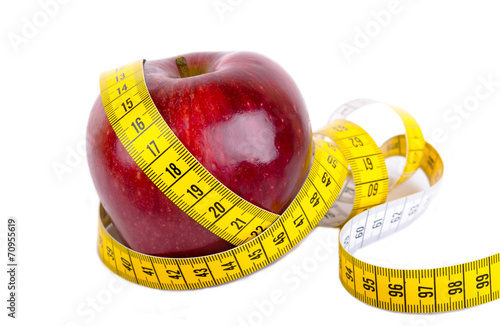 Measuring tape wrapped around a apple weight loss photo photo