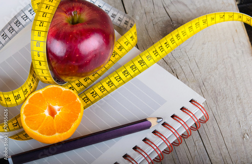 Measuring tape wrapped around a apple weight loss photo photo