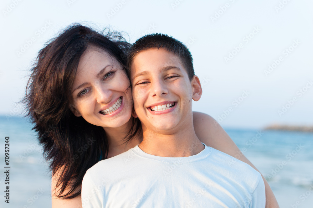 Mother with her son are having fun on the beach Mother with her son are having fun on the beach