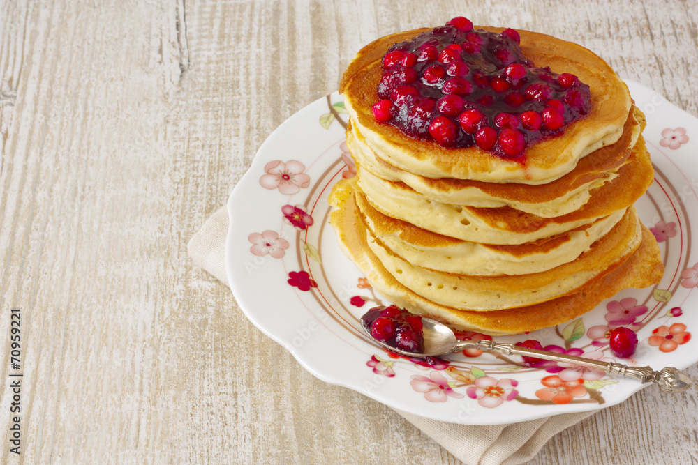 Pancake stack with lingonberry jam and fresh apples Pancake stack with lingonberry jam and fresh apples