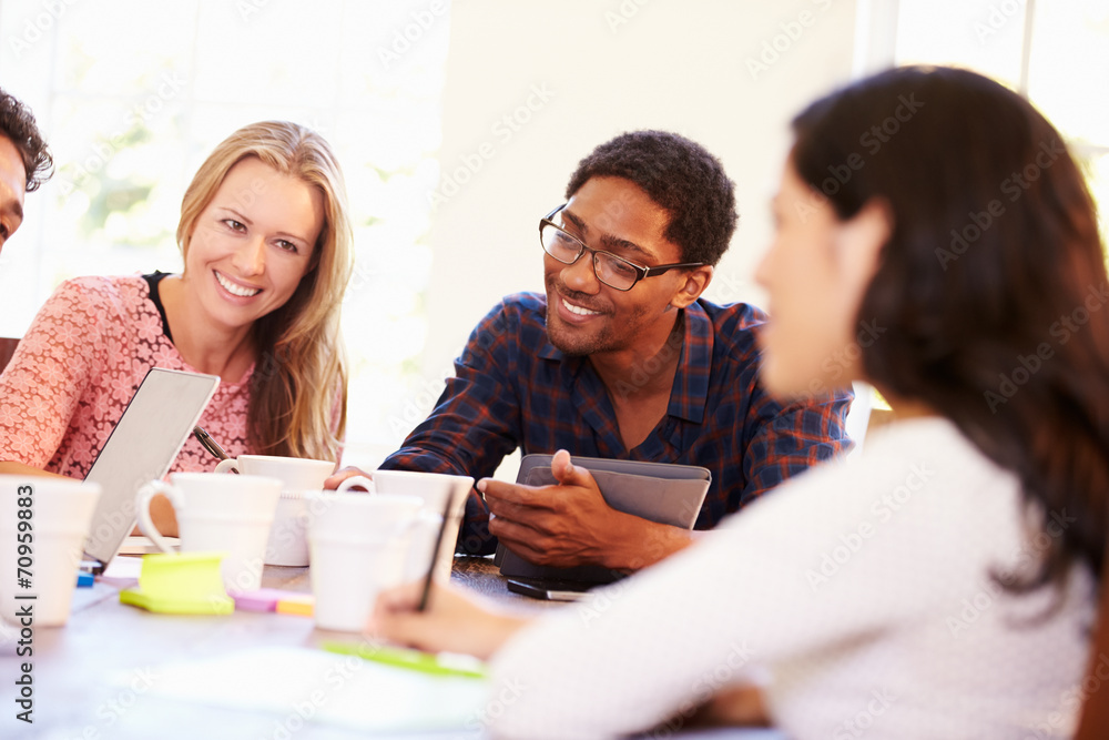 Group Of Business People Sitting Around Table In Meeting Group Of Business People Sitting Around Table In Meeting