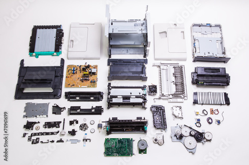 Disassembled printer on a white background
