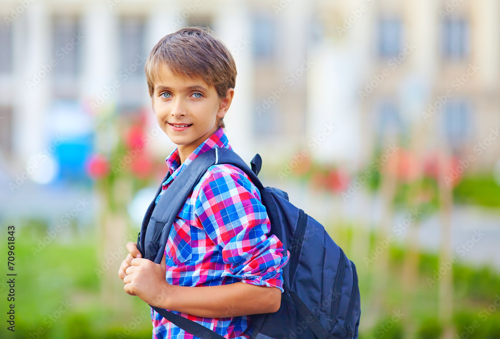 portrait of cute schoolboy with backpack, outdoors portrait of cute schoolboy with backpack, outdoors