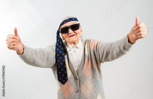 Fototapeta bohemian grandma with a tie on her forehead