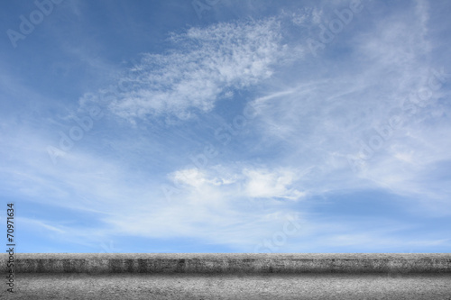 concrete ground with cloudy sky
