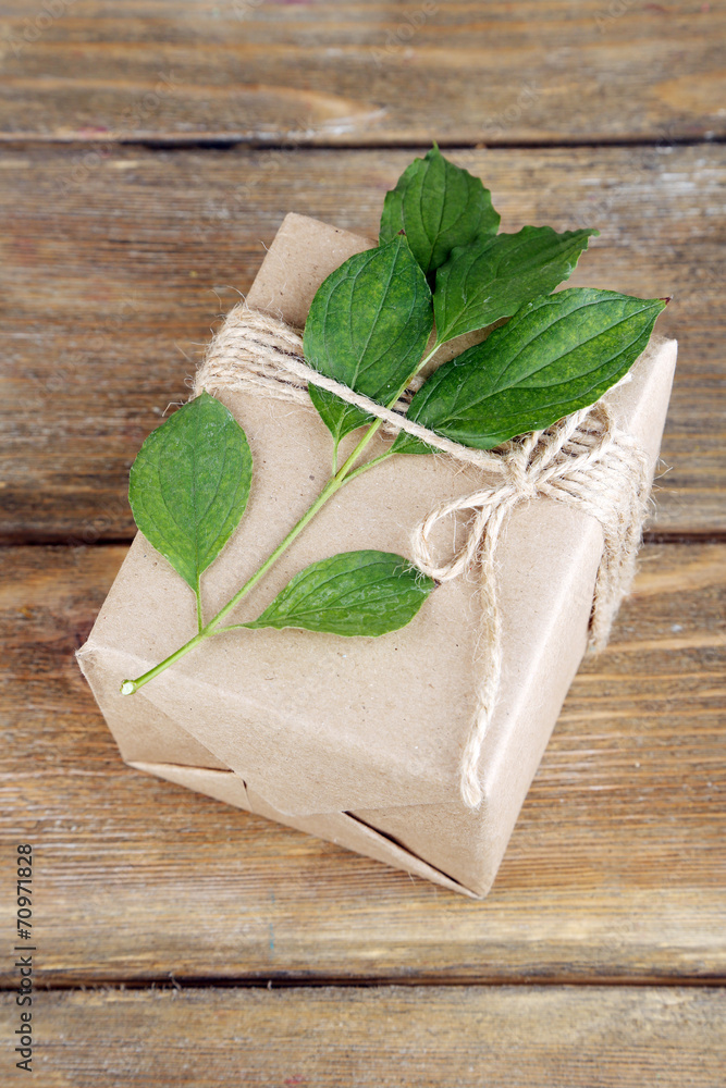 Natural style handcrafted gift box with fresh leaves and rustic Natural style handcrafted gift box with fresh leaves and rustic