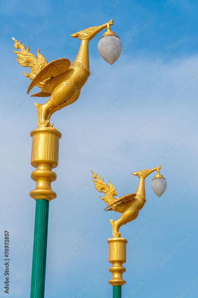 gold thai swan molded figure with lamp street