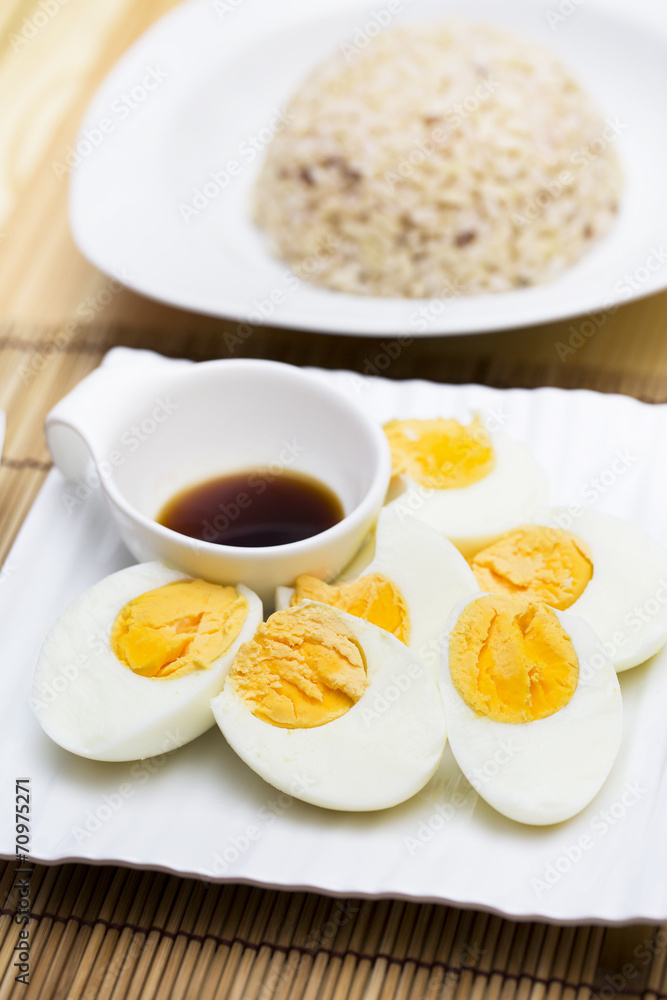 Boiled eggs with sauce and stream rice Boiled eggs with sauce and stream rice
