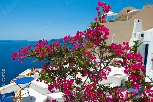 Cosy balcony with flowers on Santorini, Greece.