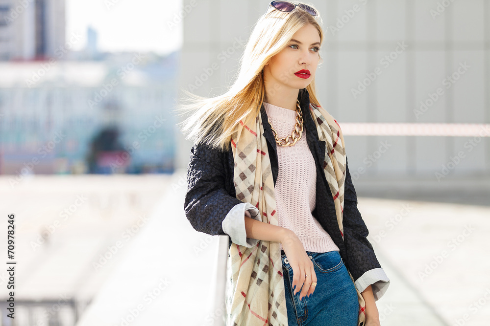 Stylish fashion portrait of blonde woman. Posing in the city Stylish fashion portrait of blonde woman. Posing in the city