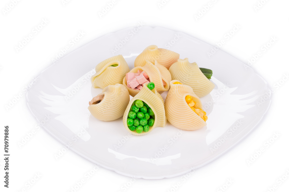 Pasta shells stuffed with vegetables and sausage. Pasta shells stuffed with vegetables and sausage.
