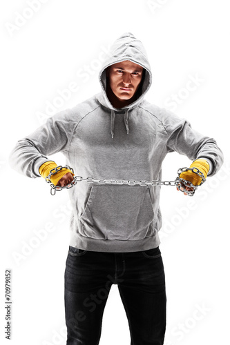 Fotografija Vertical shot of a hooligan holding a chain
