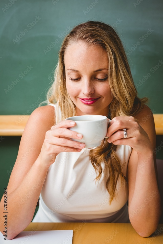 Beautiful businesswoman drinking coffee Beautiful businesswoman drinking coffee
