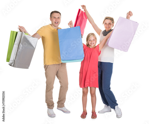 Young Family Shopping Together