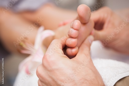 Pedicurist massaging a customers foot © WavebreakmediaMicro