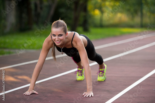 Woman working out on athlete track