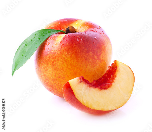 Obraz na plátně Ripe peach with leaf.
