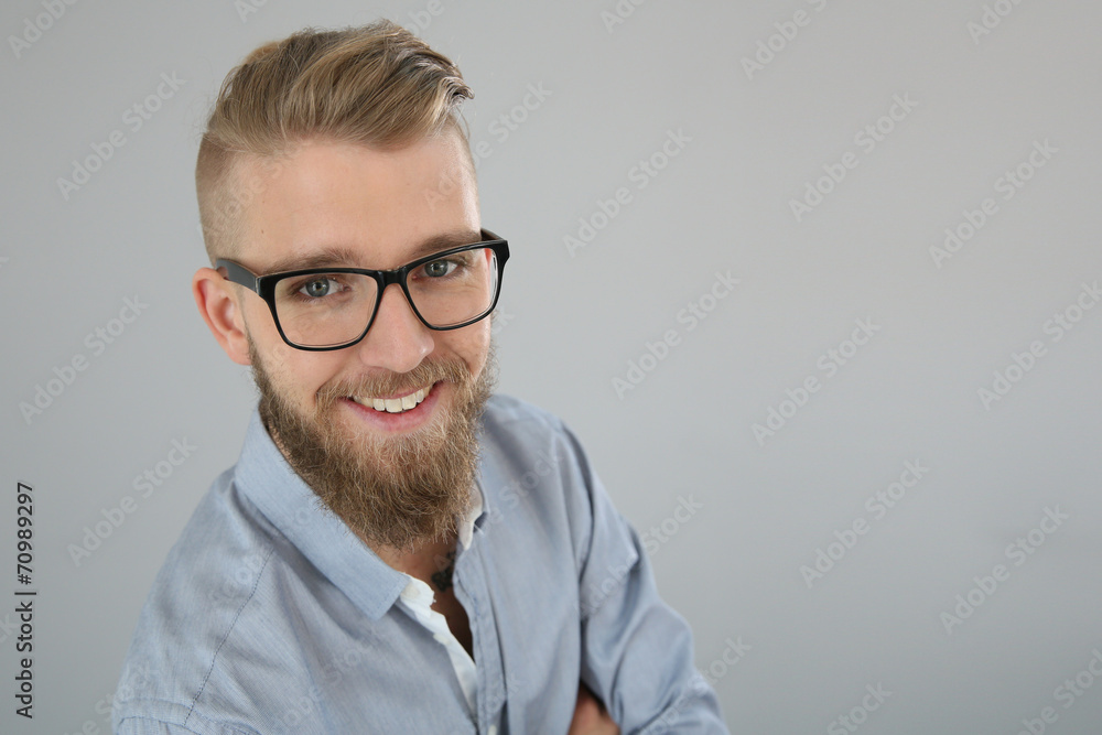 Portrait of trendy smiling guy looking at camera, isolated Portrait of trendy smiling guy looking at camera, isolated