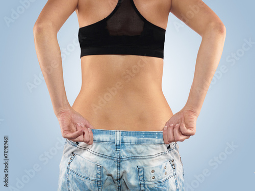 Woman with big jeans weight loss © Lovrencg
