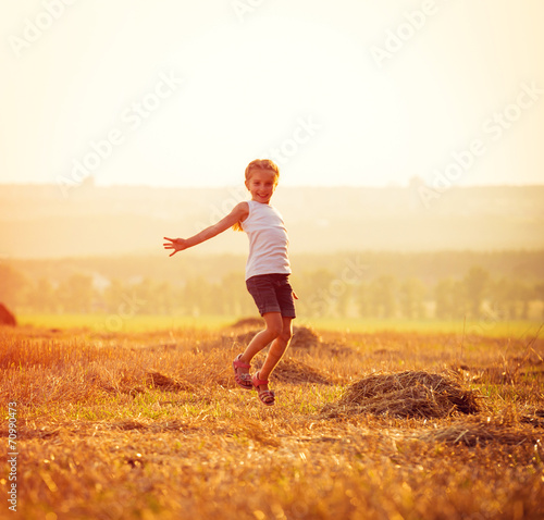 happy little girl jumping