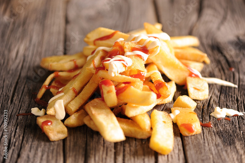French Fries Covered in Tomato Ketchup and mayonaise