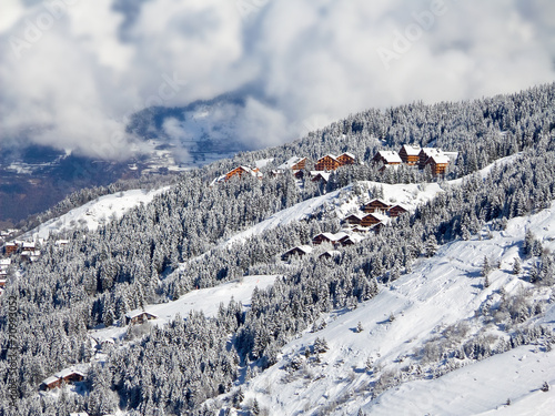 Snowy landscape with ski chalets, Meribel, the Alps, France #70993052