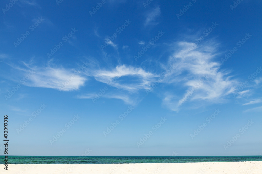 Beautiful cloudy sky over sandy beach. Nature background