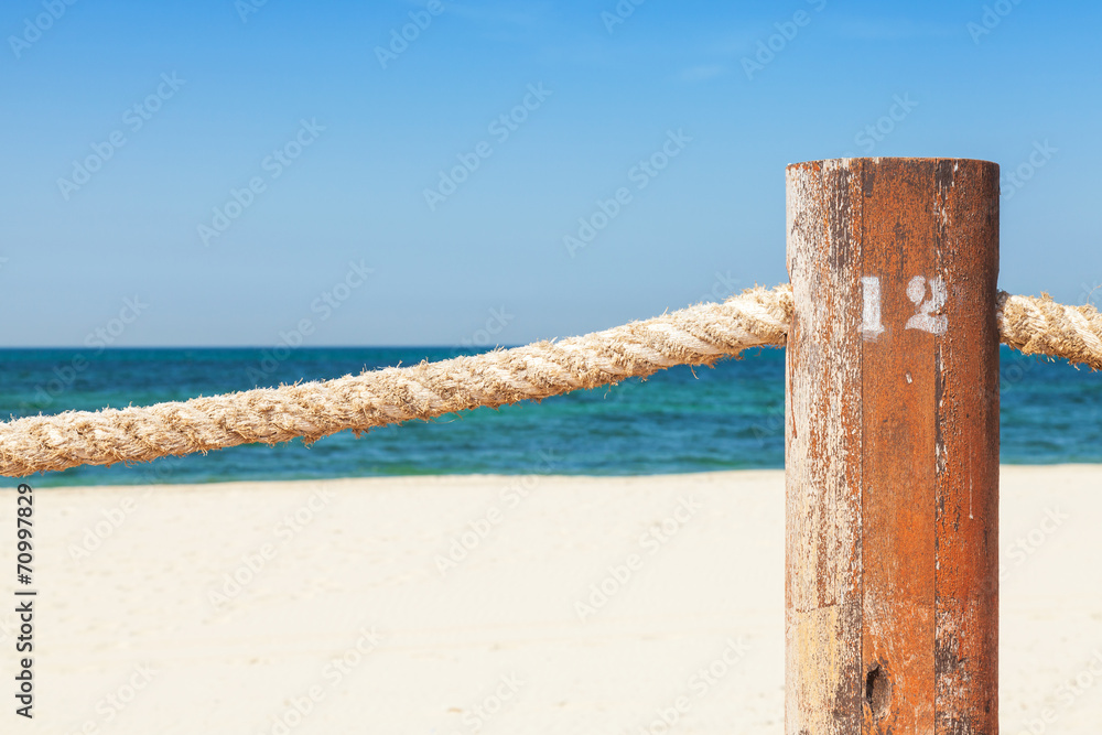 Beach border railing with rope in the summer day Beach border railing with rope in the summer day