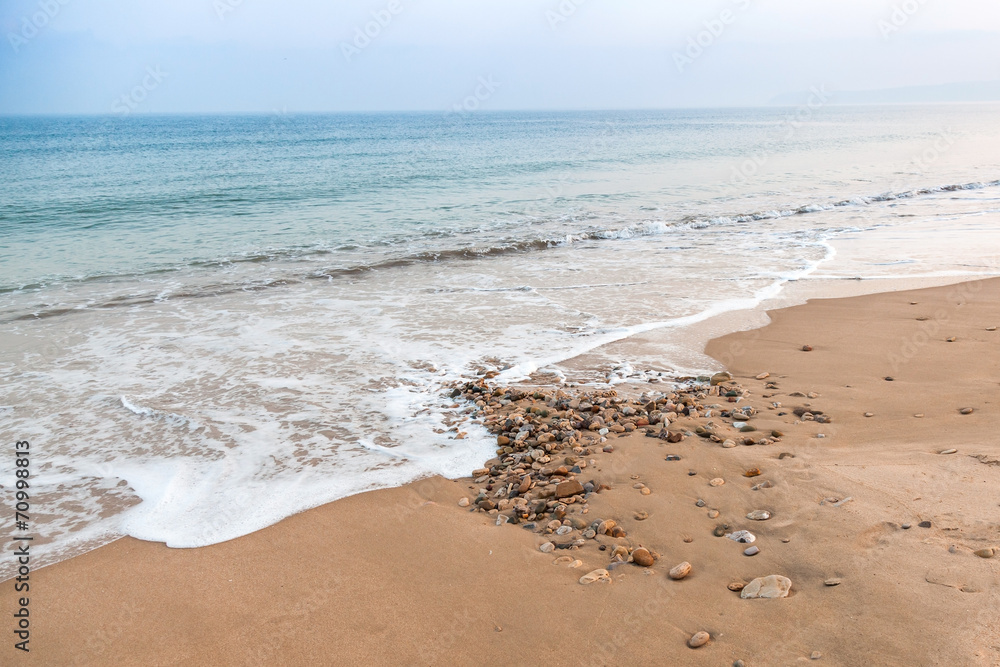 Atlantic ocean coast with sand and pebble Atlantic ocean coast with sand and pebble