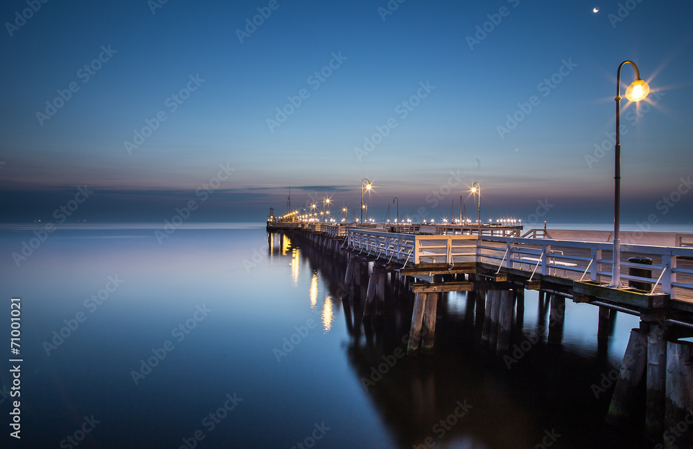 Sunrise at the pier in Sopot, Poland. 