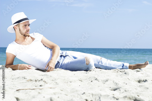 male model enjoying summer travel holiday by the sea.