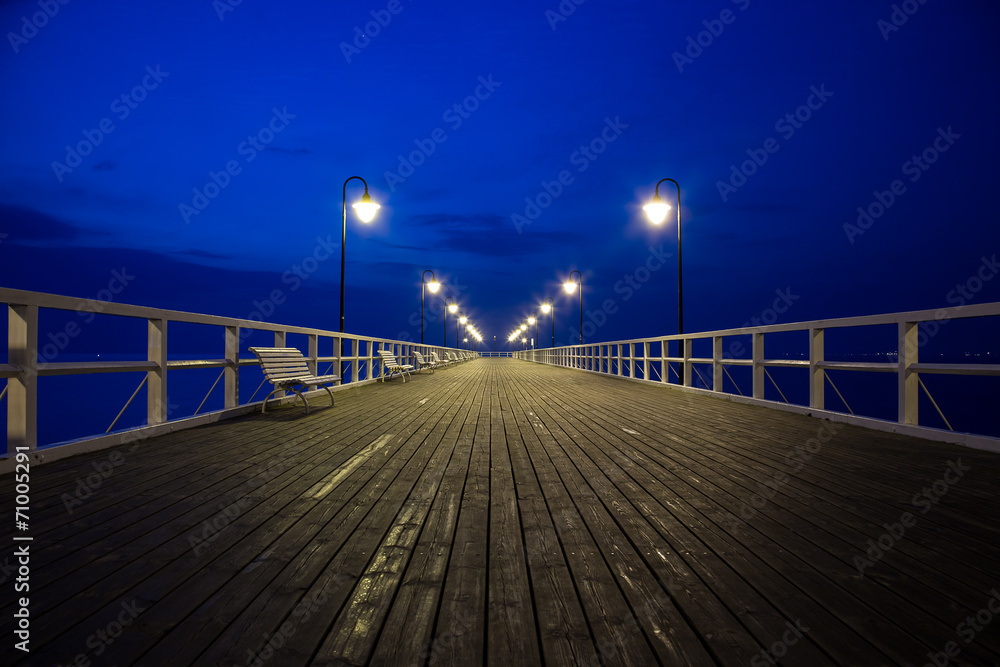 Sunrise on the pier at the seaside, Gdynia Orlowo, Poland
