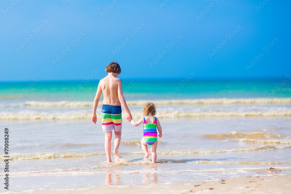 Kids walking on a beach