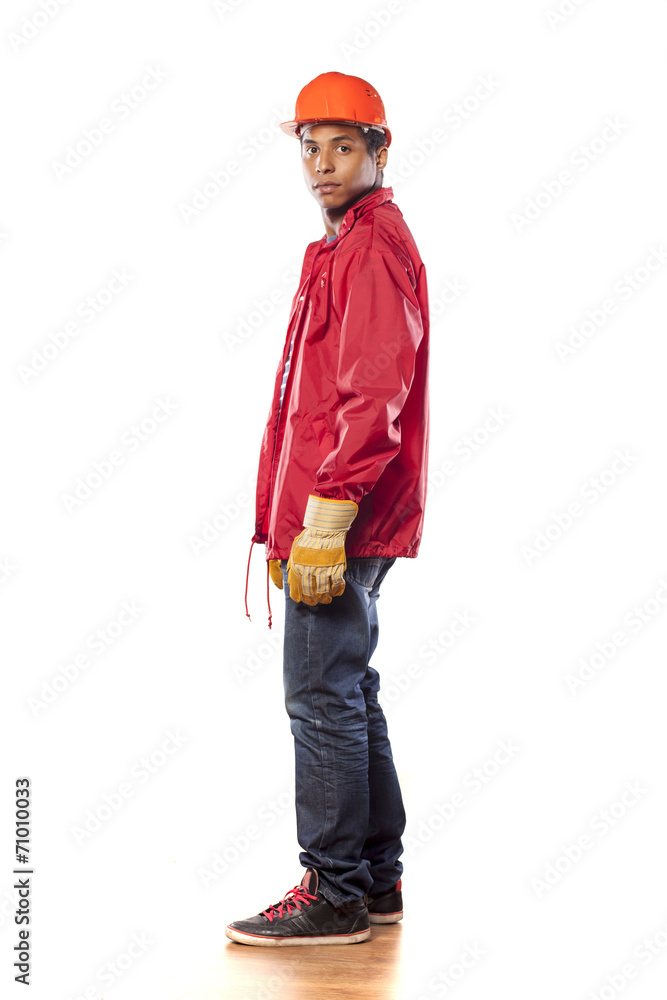 side view of a dark-skinned worker with helmet and gloves side view of a dark-skinned worker with helmet and gloves