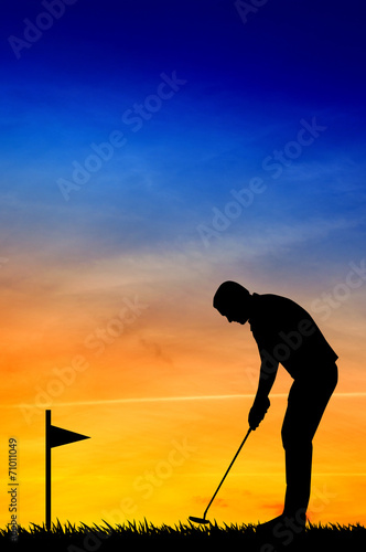 Golfer silhouette at sunset