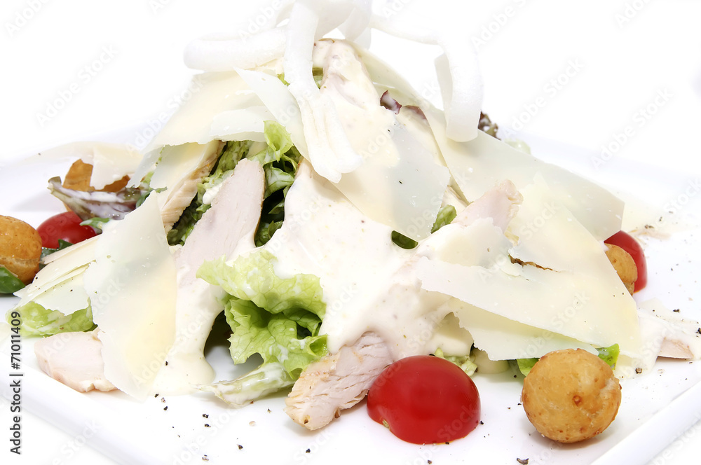 salad with vegetables, meat and cheese on white background salad with vegetables, meat and cheese on white background