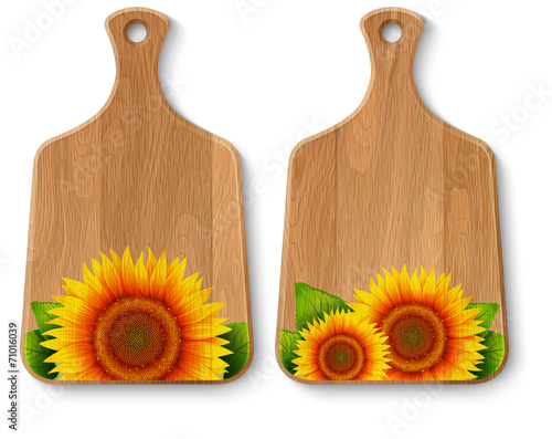 Set of realistic wooden cutting boards painted with sunflowers