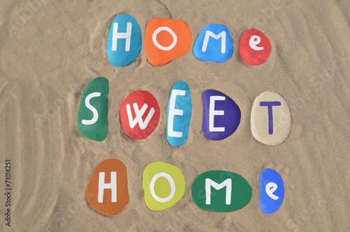 Home sweet home concept on colored stones