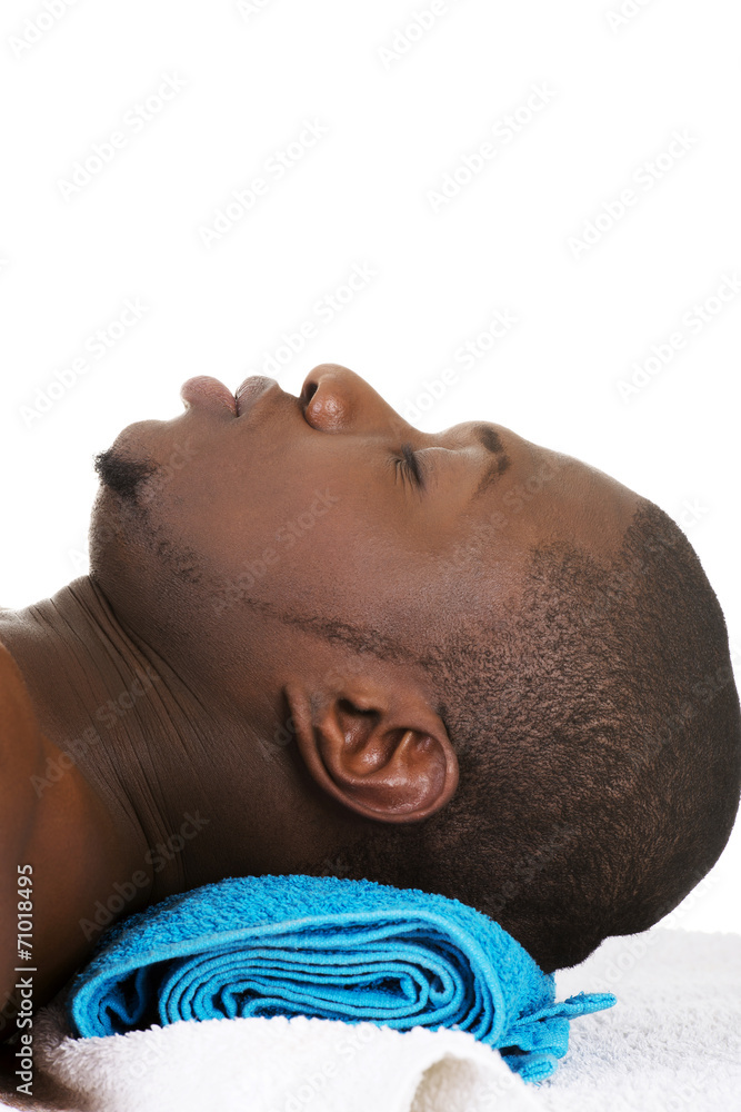 Man lying on a massage table Man lying on a massage table