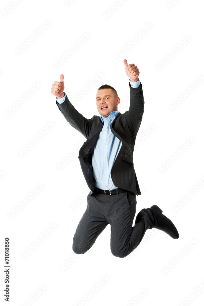 Happy businessman jumping