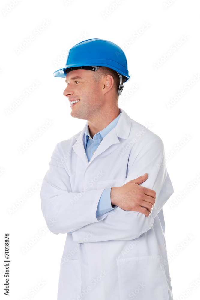 Man in a lab coat and helmet